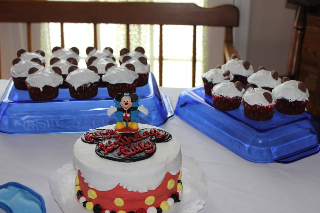 My nephew's adorable Mickey Mouse birthday cake with Mickey inspired cupcakes made by Karen.